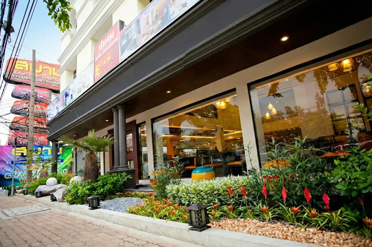 Front view of hotel building on Ngamwongwan Road, ideal investment property with approved plans for a new condominium project.