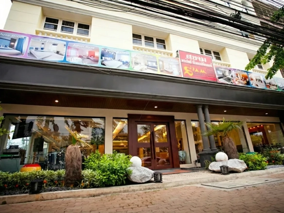 Exterior of Hotel with Wellness Spa for Sale in Chatuchak Bangkok featuring a landscaped garden.