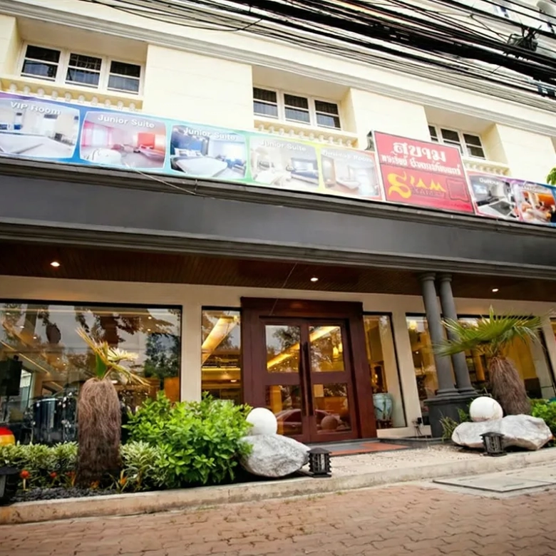 Exterior of Hotel with Wellness Spa for Sale in Chatuchak Bangkok featuring a landscaped garden.