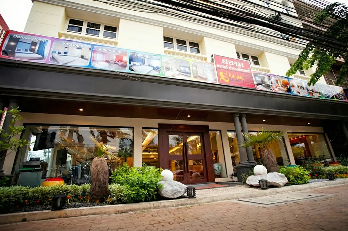 Exterior of Hotel with Wellness Spa for Sale in Chatuchak Bangkok featuring a landscaped garden.