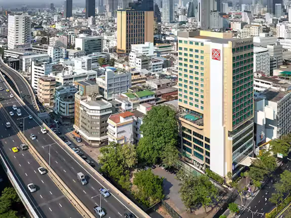 4-star business hotel for sale on Silom Road Bangkok Aerial night city skyline highlighting prime hotel investment location