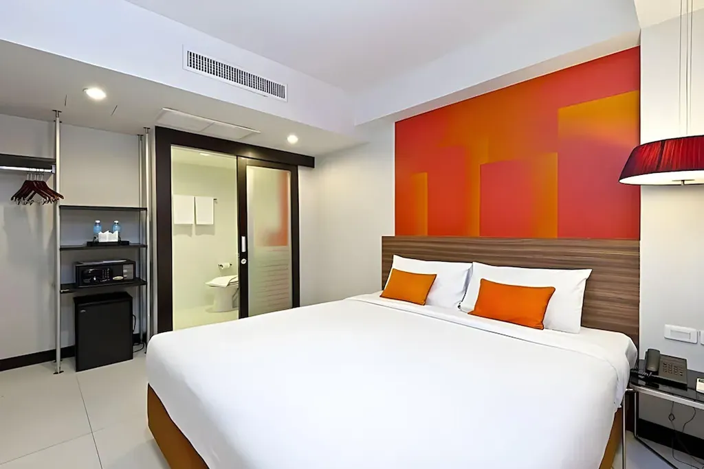 Bright hotel room interior with functional layout