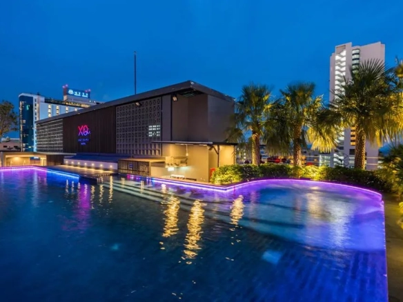 Guest room with pool view at night in North Pattaya