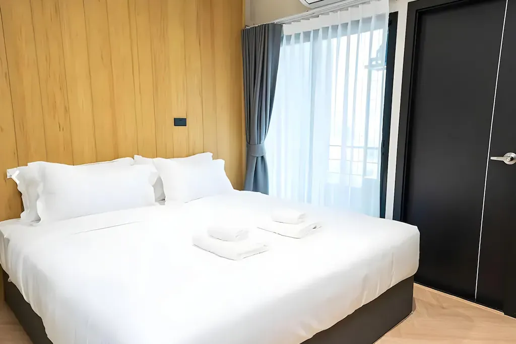 Clean and functional hotel bedroom layout