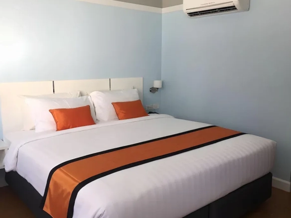 Hotel bedroom with city view and natural light