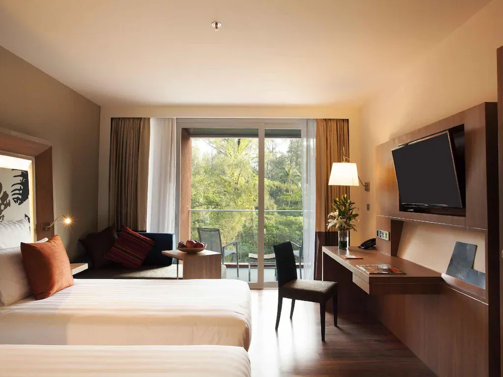 Spacious guest room with sofa seating area