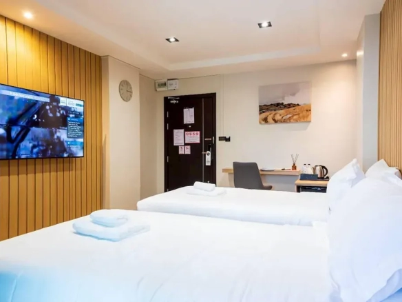 Guest room with natural daylight and city comfort