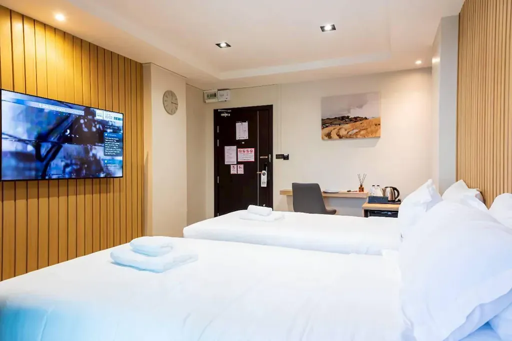 Guest room with natural daylight and city comfort