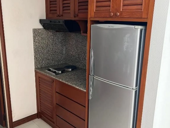 Kitchen pantry with refrigerator