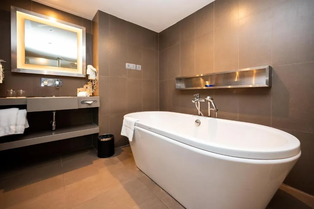 Hotel suite bathroom with bathtub