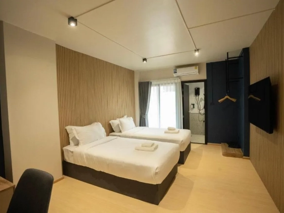 Wide-angle view of hotel guest room