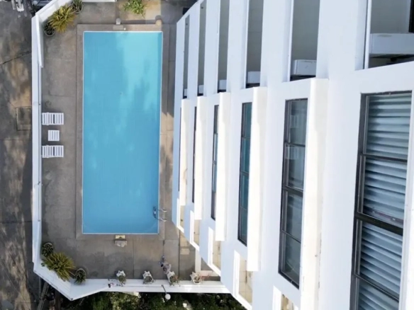 Hotel swimming pool with building view