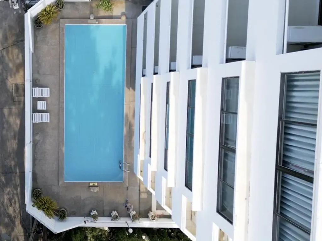 Hotel swimming pool with building view
