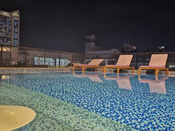 Rooftop swimming pool at night in North Pattaya boutique hotel