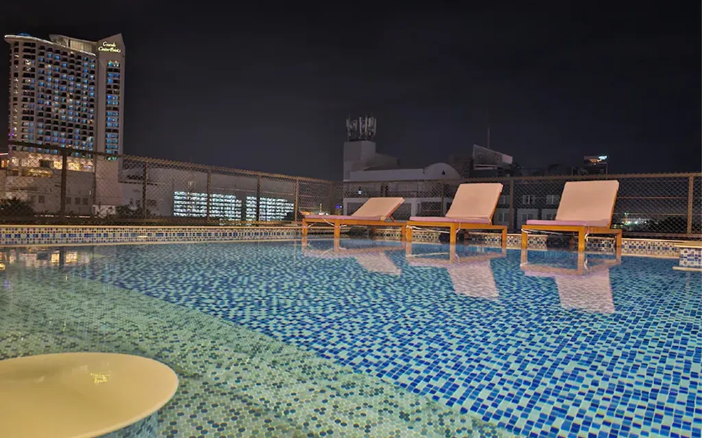 Rooftop swimming pool at night in North Pattaya boutique hotel