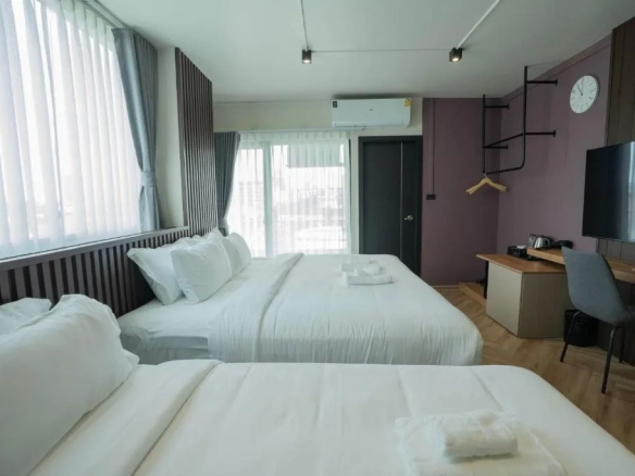 Hotel bedroom with soft tones and calm atmosphere