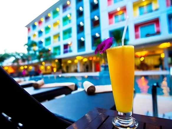 Refreshing drink by the swimming pool at The Ninth Pattaya Hotel Pattaya