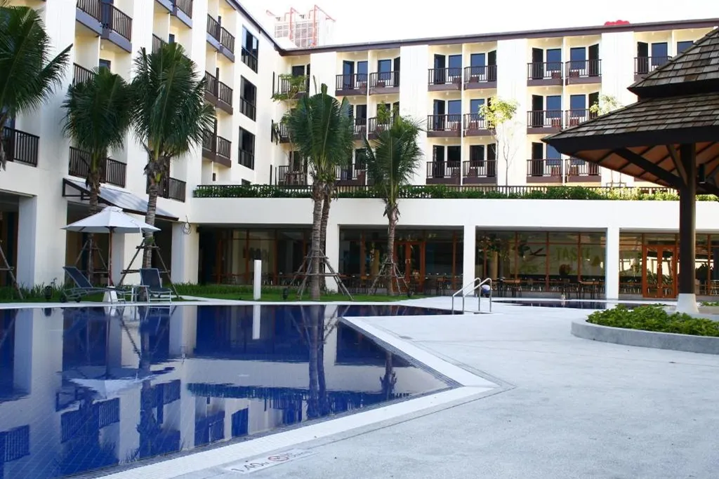 Swimming pool surrounded by hotel buildings