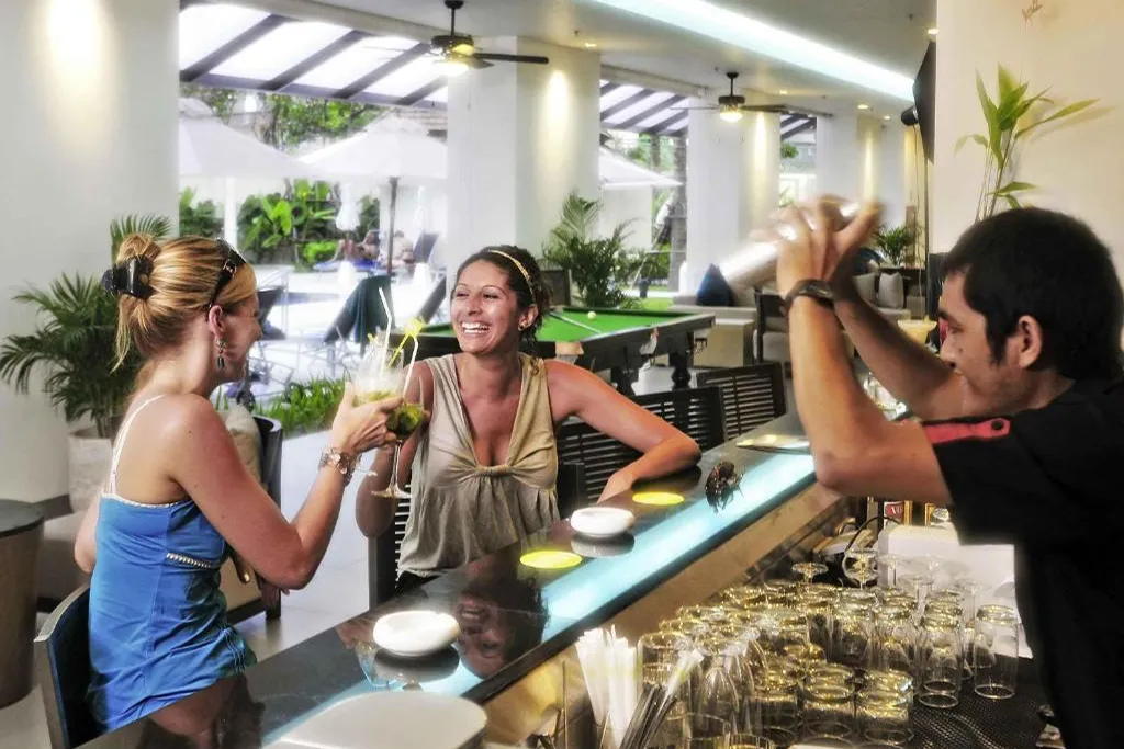 Guests enjoying drinks at hotel bar