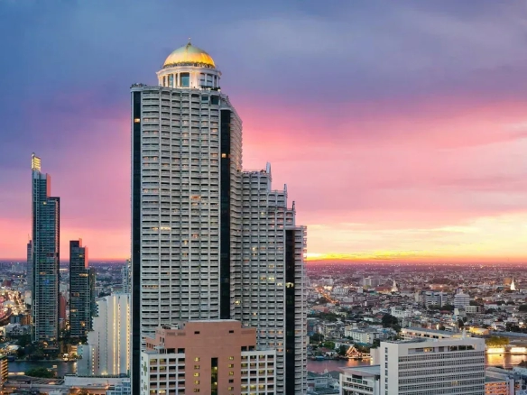 High-rise hotel building at sunset in central Bangkok