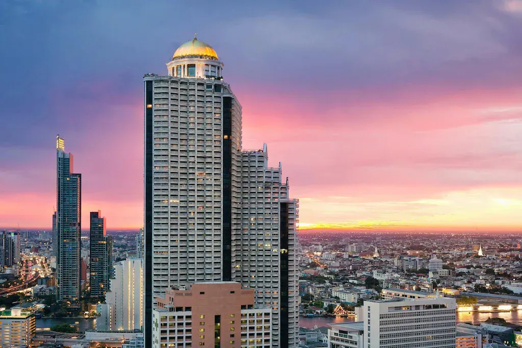High-rise hotel building at sunset in central Bangkok