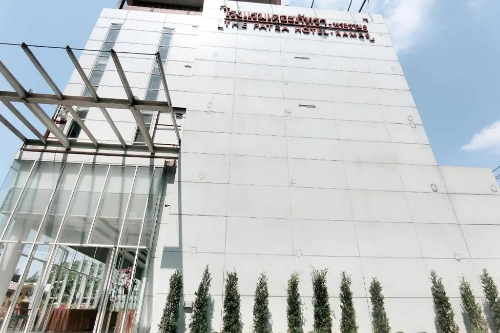 Daytime exterior view of Patra hotel building in urban location