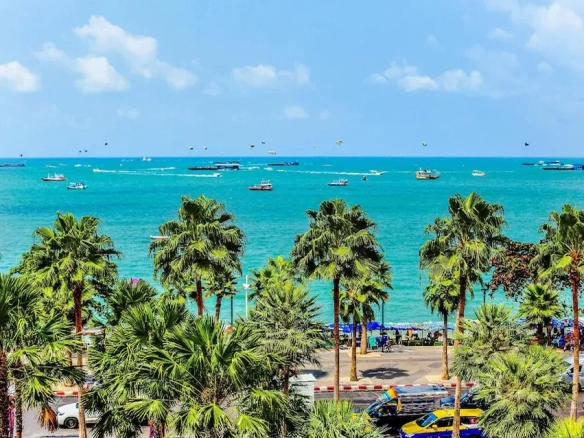 Pattaya Beach with palm trees near boutique hotel