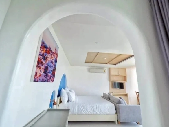 Modern hotel bedroom with natural light and window view
