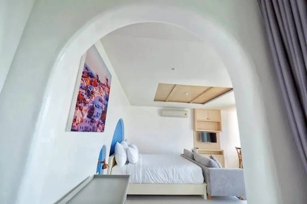 Modern hotel bedroom with natural light and window view