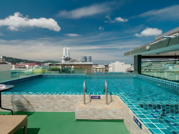 Daytime rooftop swimming pool at boutique hotel