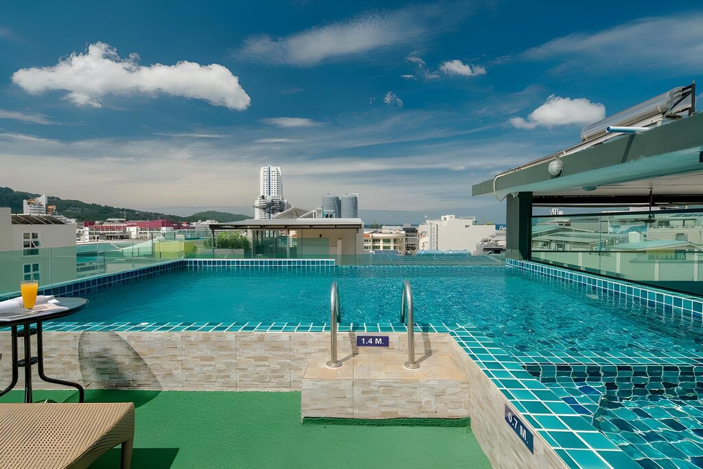 Daytime rooftop swimming pool at boutique hotel