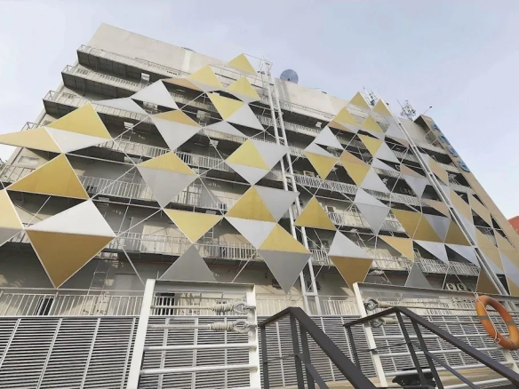 Evening exterior view of urban hotel property