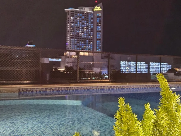 Rooftop pool city view at night in North Pattaya