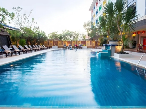Lobby area of The Ninth Pattaya Hotel Pattaya with modern seating and warm lighting