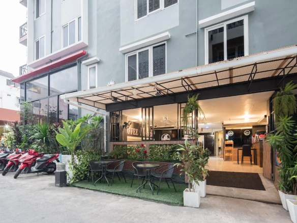 Front building view of boutique hotel for sale