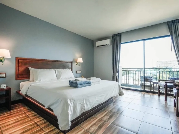 Spacious guest room with balcony access