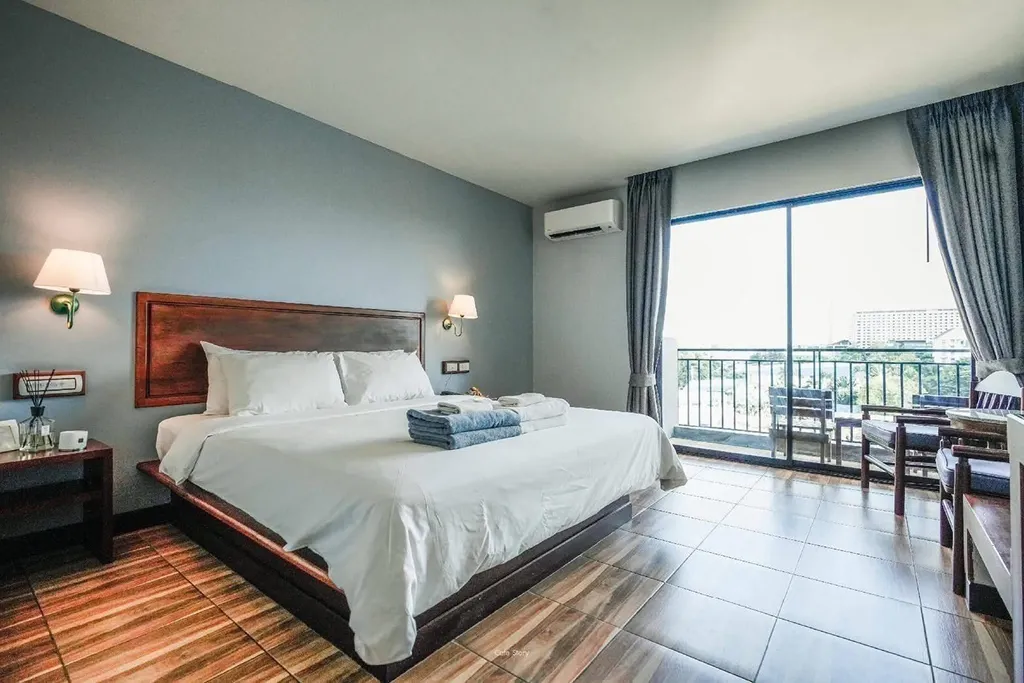Spacious guest room with balcony access