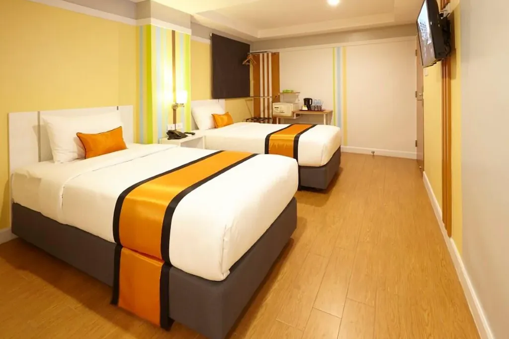 Modern guest room with king bed and city hotel design