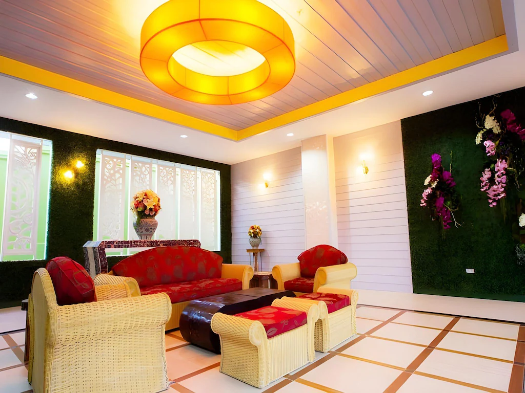 Lobby area of The Ninth Pattaya Hotel Pattaya with modern seating and warm lighting