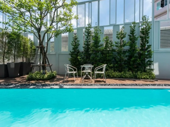 Outdoor pool area within hotel premises in Bangkok Noi Bangkok