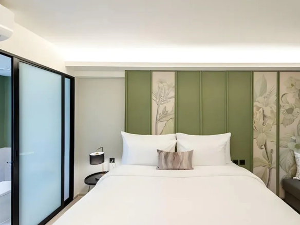 Guest room interior showing furnishing and layout of hotel for sale in Bangkok Noi Bangkok