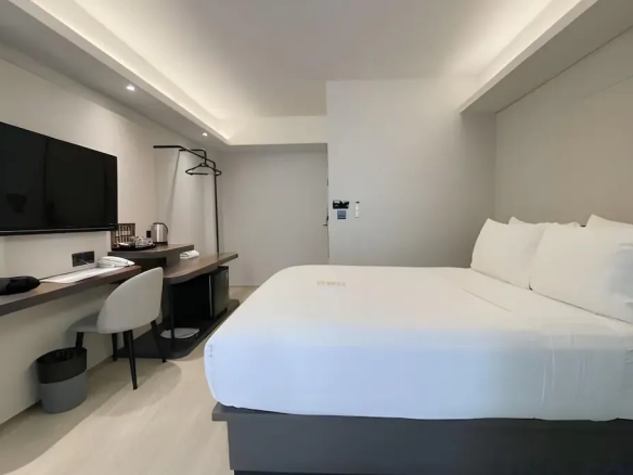 Guest room interior showing compact room configuration of hotel for sale in Bangkok Noi Bangkok