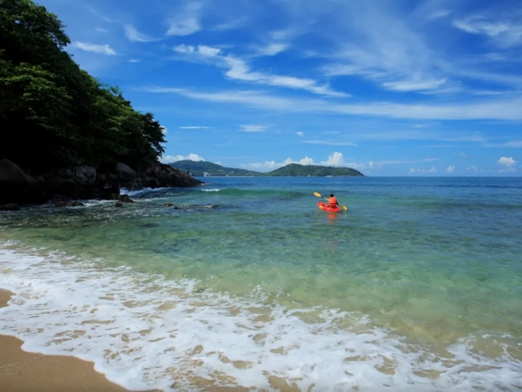 Kayaking in clear sea at private beach Phuket