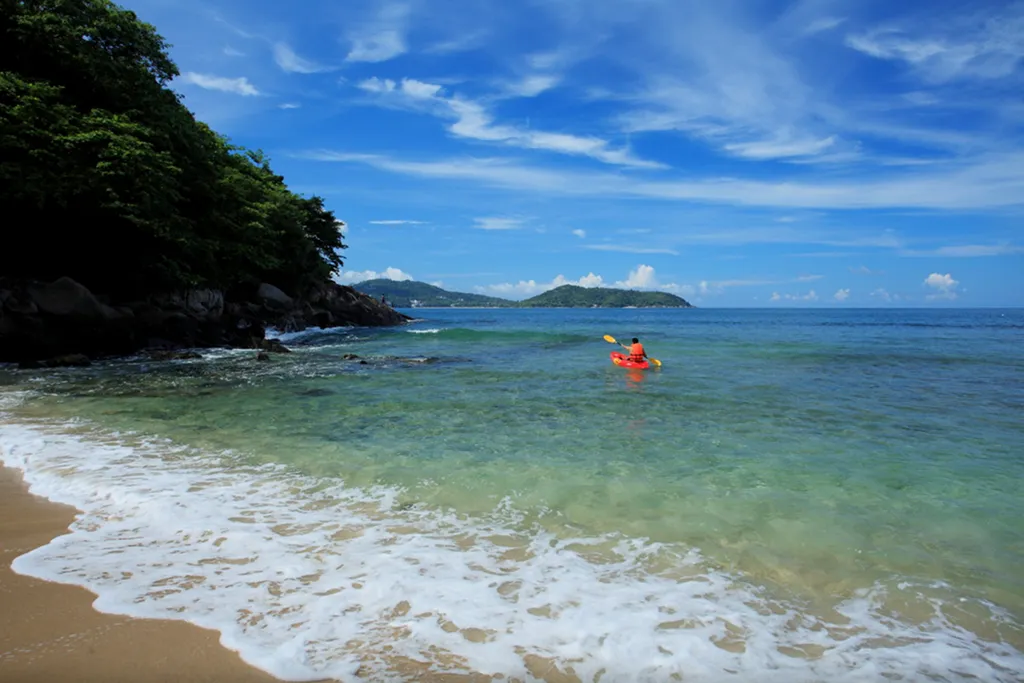 Kayaking in clear sea at private beach Phuket