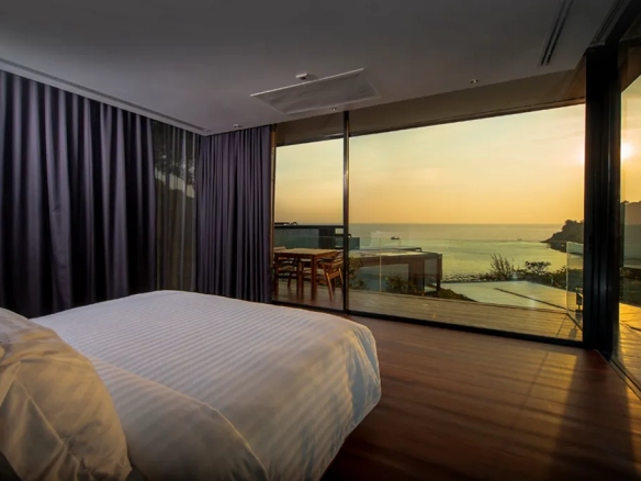 Luxury seaside villa bedroom with sunset sea view in Phuket