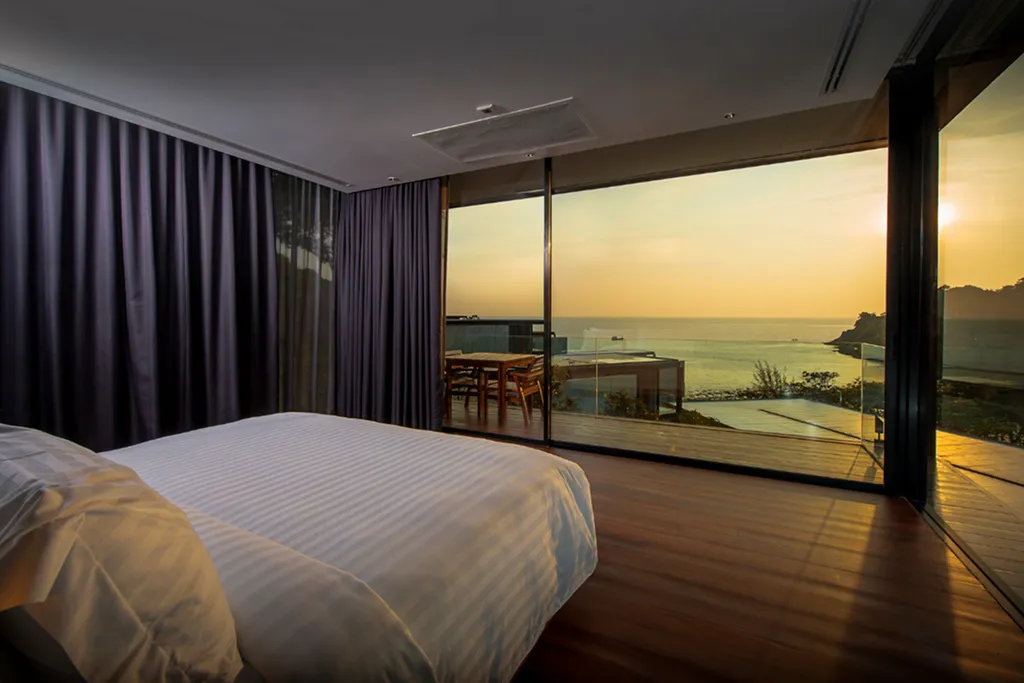 Luxury seaside villa bedroom with sunset sea view in Phuket