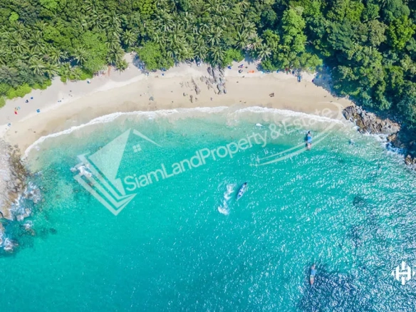 Banana Beach Cherng Talay stunning aerial top-down view showcasing the crystal clear turquoise bay and white sand crescent