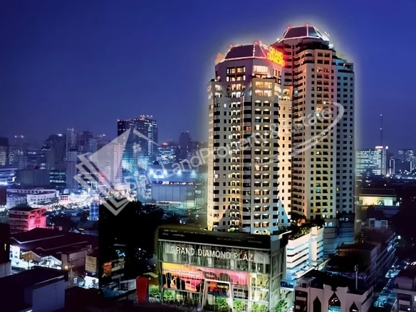 Grand Diamond Suites Hotel high-rise building sparkling beautifully against the city night sky