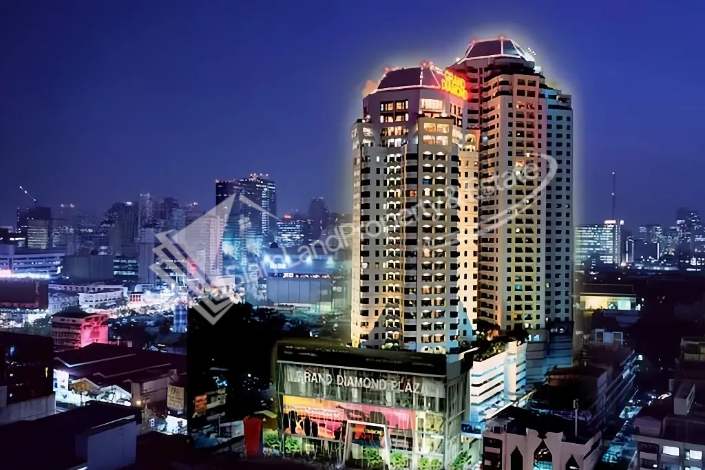 Grand Diamond Suites Hotel high-rise building sparkling beautifully against the city night sky