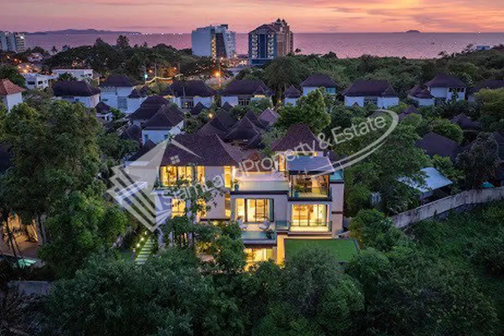 Luxury premium pool villa aerial twilight